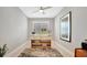 Bright office area with a modern wooden desk and neutral decor at 27061 Paradise Shores Dr, Englewood, FL 34223