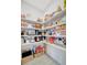 Walk-in pantry with wire shelving, providing ample storage space at 27061 Paradise Shores Dr, Englewood, FL 34223