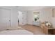 Serene bedroom featuring wood floors, natural light, and ample closet space at 2833 Bay Shore Cir, Sarasota, FL 34234