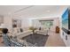 Bright living room with a large comfortable sofa and stylish decor with hardwood floors at 2833 Bay Shore Cir, Sarasota, FL 34234