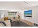 Bright living room with a large comfortable sofa and stylish decor, with hardwood floors at 2833 Bay Shore Cir, Sarasota, FL 34234