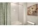 Bathroom with shower-tub combination and artistic painting on the wall at 2907 61St E Ter, Ellenton, FL 34222