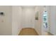 Welcoming hallway with wood floors leading to a bedroom at 2907 61St E Ter, Ellenton, FL 34222