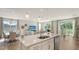 Open concept kitchen featuring a spacious island with stainless steel appliances and views of living area at 2907 61St E Ter, Ellenton, FL 34222