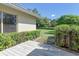 Well-maintained backyard features a wood deck, lush landscaping, and green lawn at 3647 Country Place Blvd, Sarasota, FL 34233