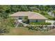Charming single-story home showcasing professionally landscaped front yard with a tile roof at 3647 Country Place Blvd, Sarasota, FL 34233