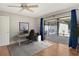 Well-lit home office with sliding doors leading to the lanai at 3647 Country Place Blvd, Sarasota, FL 34233