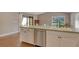 Bright kitchen island featuring stainless steel appliances and natural light at 3647 Country Place Blvd, Sarasota, FL 34233