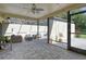 A covered lanai with brick pavers and comfortable seating, perfect for outdoor relaxation at 3647 Country Place Blvd, Sarasota, FL 34233