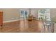 Open living space featuring wood-look flooring, large windows, and a cozy reading nook at 3647 Country Place Blvd, Sarasota, FL 34233