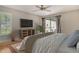 Inviting main bedroom with lots of natural light, a ceiling fan, and access to the outdoors at 3647 Country Place Blvd, Sarasota, FL 34233