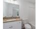 Well-lit bathroom with granite countertops, and a tub at 3712 19Th E St, Bradenton, FL 34208