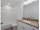 Bathroom featuring a white vanity with granite countertops and shower-tub combo at 3712 19Th E St, Bradenton, FL 34208