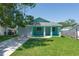 Charming single-story home featuring a well-manicured lawn and a welcoming front porch at 3712 19Th E St, Bradenton, FL 34208