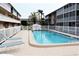 Community pool with lounge chairs in a well maintained outdoor space at 3751 S School Ave # 19, Sarasota, FL 34239