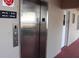 Building elevator which provides access to upper floors for residents at 3751 S School Ave # 19, Sarasota, FL 34239