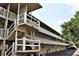 Exterior angle shot showing the multiple balconies and stairs at 3751 S School Ave # 19, Sarasota, FL 34239
