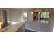 Living room with open concept kitchen with stainless steel appliances and an island at 3751 S School Ave # 19, Sarasota, FL 34239