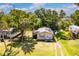 Cozy single-story home with a well-maintained lawn, mature trees, and a glimpse of neighborhood charm at 409 Olive Ave, Nokomis, FL 34275