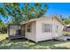 Side view of a home with a screened in patio at 409 Olive Ave, Nokomis, FL 34275