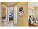 Hallway displaying a dream catcher on the wall, leading to other rooms at 409 Olive Ave, Nokomis, FL 34275