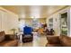 Comfortable seating and a table for relaxation in a common area at 409 Olive Ave, Nokomis, FL 34275