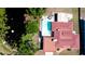 Aerial view of a home featuring a large pool and a pond nearby at 4616 22Nd W Ave, Bradenton, FL 34209