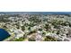 Aerial view of property with golf course, ponds, and tree coverage at 4616 22Nd W Ave, Bradenton, FL 34209