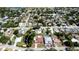 Aerial view showcasing a home surrounded by greenery and neighborhood houses at 4616 22Nd W Ave, Bradenton, FL 34209