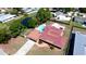 An aerial view of a property with a well-kept yard, a private pool, and proximity to a tranquil pond at 4616 22Nd W Ave, Bradenton, FL 34209
