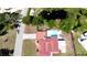 Aerial view of a home with a private pool and a pond nearby at 4616 22Nd W Ave, Bradenton, FL 34209