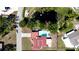 Aerial view of a home with a pool and a pond nearby at 4616 22Nd W Ave, Bradenton, FL 34209