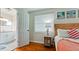 Bedroom with view into ensuite bathroom, featuring a side table with a seahorse lamp at 4616 22Nd W Ave, Bradenton, FL 34209