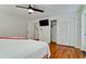 Bedroom featuring closet, TV, and ensuite access to bathroom with tiled floor at 4616 22Nd W Ave, Bradenton, FL 34209