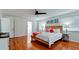 Bedroom featuring hardwood floors, a ceiling fan, beach-themed decor, and a wood bed frame at 4616 22Nd W Ave, Bradenton, FL 34209