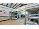 Spacious bedroom with bunk beds, dresser, and sliding door to back yard at 4616 22Nd W Ave, Bradenton, FL 34209