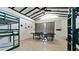 Bonus room includes high ceilings, wainscotting, bunk beds, and ping pong table at 4616 22Nd W Ave, Bradenton, FL 34209