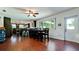 Spacious dining area with wood floors, a large window, a kitchen view, and seating for six at 4616 22Nd W Ave, Bradenton, FL 34209