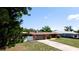 Charming single Gathering home with a red tile roof, large driveway, and attached garage at 4616 22Nd W Ave, Bradenton, FL 34209