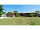 Charming single-story home with a manicured lawn, brick accents, and a two-car garage at 4616 22Nd W Ave, Bradenton, FL 34209