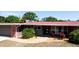 Well-maintained home with a brick accent, a red roof, neat landscaping, and a cozy front porch at 4616 22Nd W Ave, Bradenton, FL 34209