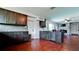 Open-concept kitchen with stone backsplash, dark wood cabinets, and stainless steel appliances at 4616 22Nd W Ave, Bradenton, FL 34209