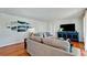Cozy living room with modern decor, featuring hardwood floors, a blue cabinet, and contemporary artwork at 4616 22Nd W Ave, Bradenton, FL 34209
