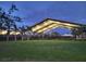 Evening view of covered, outdoor pickleball courts and green lawn area at 4616 22Nd W Ave, Bradenton, FL 34209