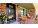 Inviting porch with brick flooring, vibrant orange chairs, and a decorative flower pot at 4616 22Nd W Ave, Bradenton, FL 34209