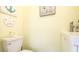 Powder room features beachy decor, including a sand dollar and anchor accent at 4721 Garcia Ave, Sarasota, FL 34233