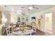 Open dining area with a round table, views to the living room and kitchen, and beachy decor at 4721 Garcia Ave, Sarasota, FL 34233