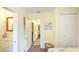 Hallway view showing neutral paint, wood floors and access to the bathroom and bedrooms at 4721 Garcia Ave, Sarasota, FL 34233