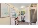 Cozy nook with a workstation, stainless steel refrigerator, and natural light from the window at 4721 Garcia Ave, Sarasota, FL 34233
