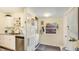Kitchen area featuring a laundry area with washer, dryer, storage, and natural light at 4721 Garcia Ave, Sarasota, FL 34233